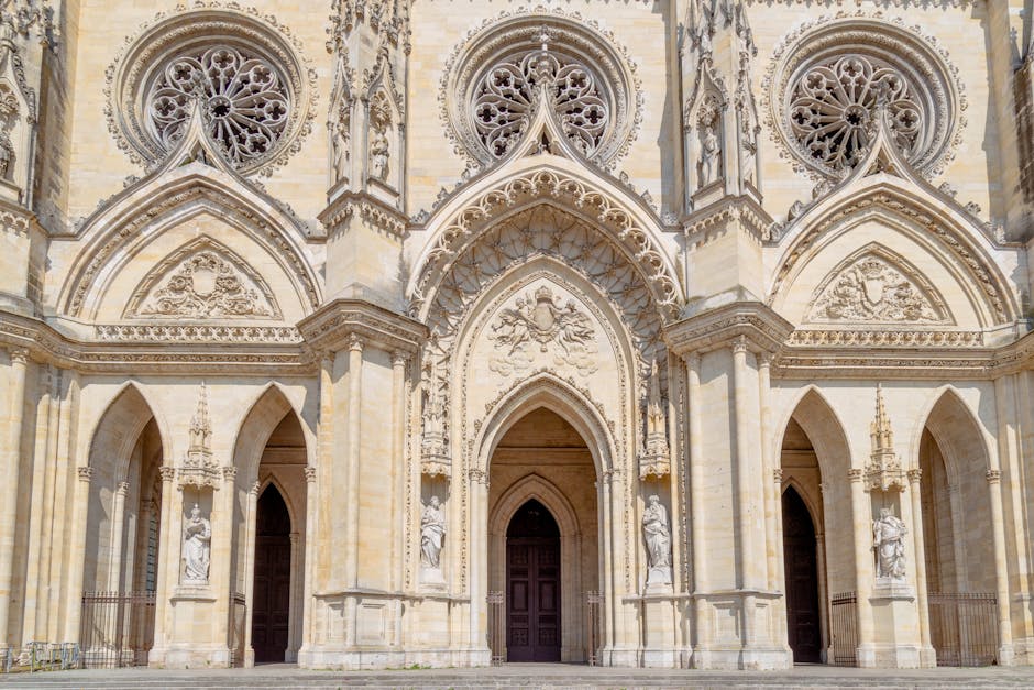 A traditional wooden boat sails along the Loire River under a historic stone bridge